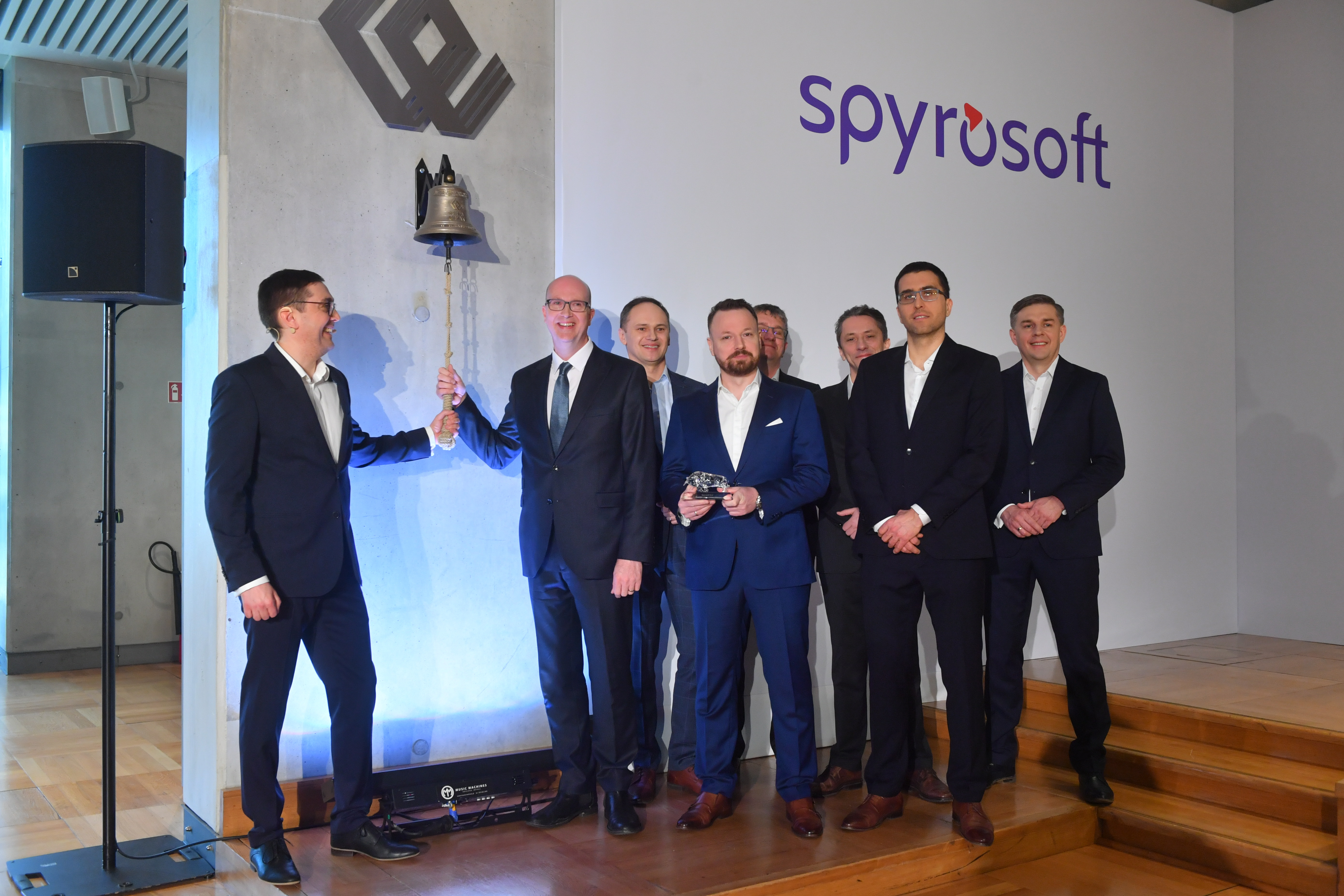 Spyrosoft's Board of Directors symbolically ringing the WSE bell