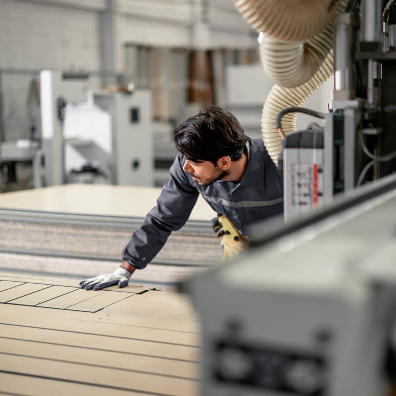 a man in a woodworking factory